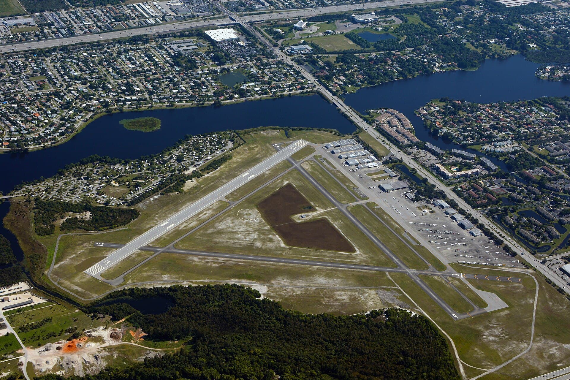 Aerial view of neighborhoods, lakes and a small airfield near Lantana in Palm Beach County, Florida